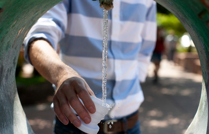 A man getting a drink of the healing waters in Historic Manitou Springs