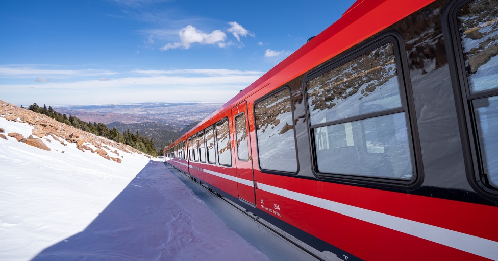 Red Train On Snowy Mountain
